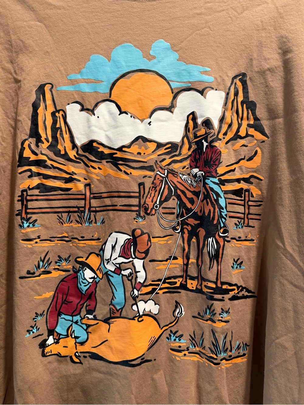 Southwestern Cowboy Graphic Tee in Tan with Orange & Turquoise Cowboy Design